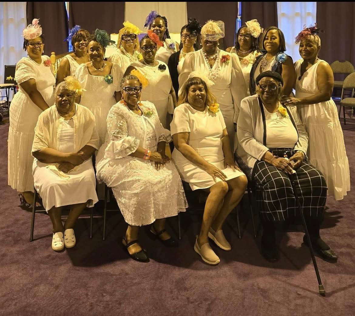 Women in white at worship service